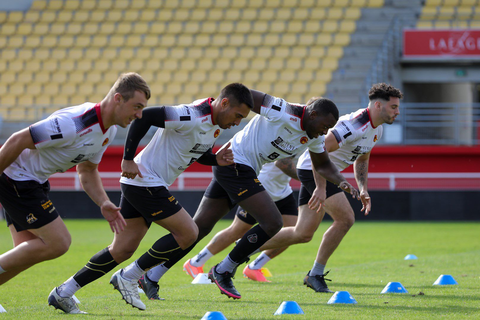 Rugby players sprinting during a training session
